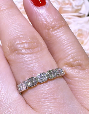 0.69ct tw Emerald Cut Diamond Bezel Set Half Eternity Band